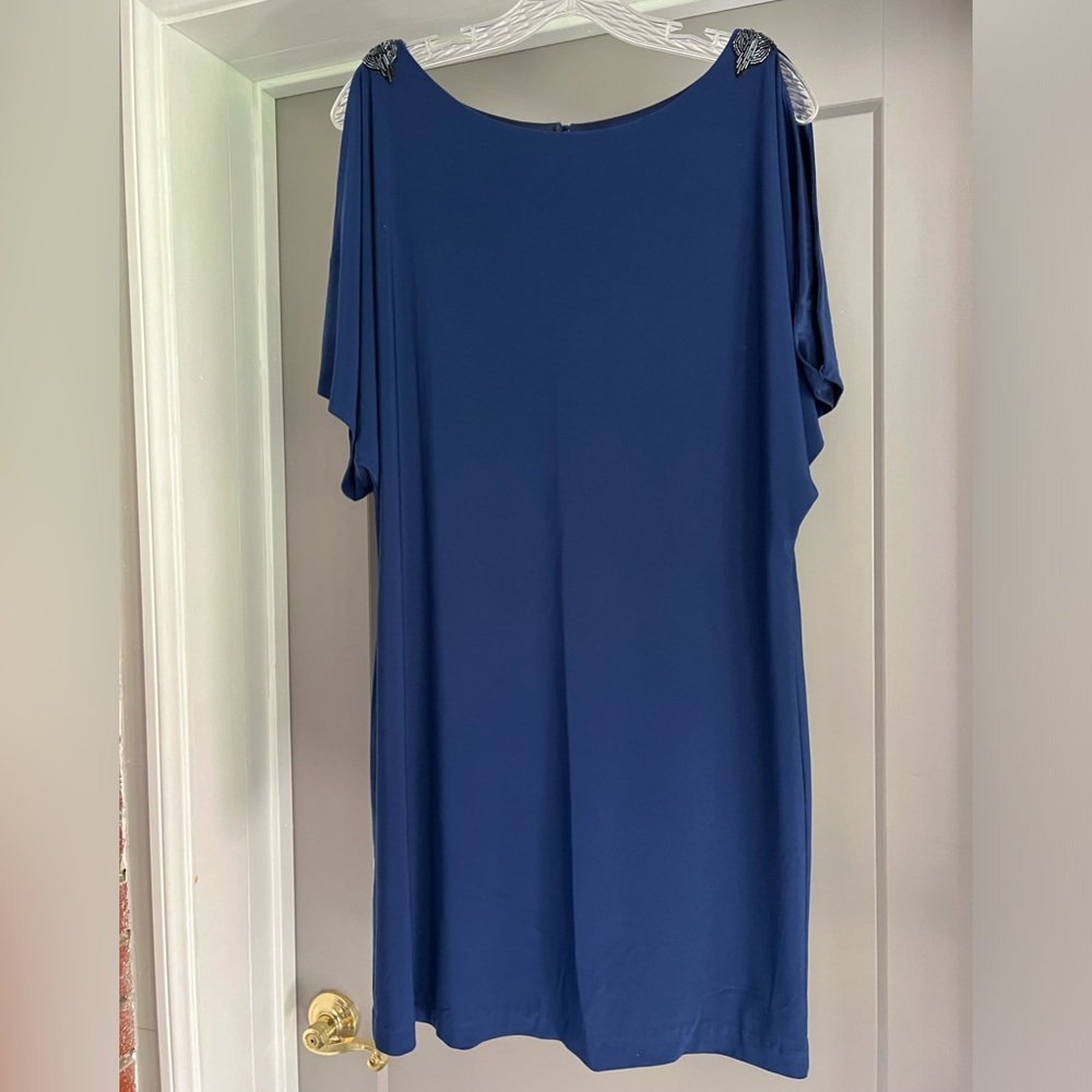 Blue mid length evening dress with shoulder cut outs.